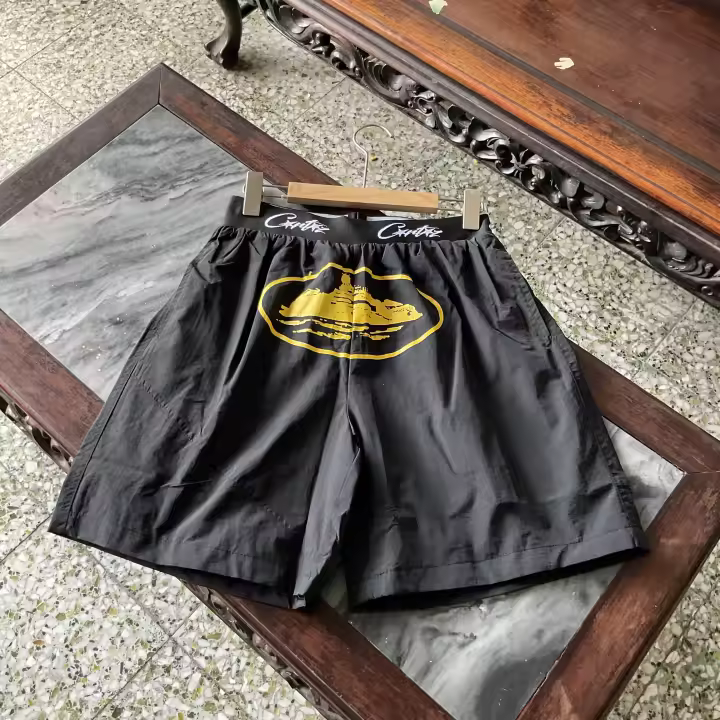 Pantalones cortos deportivos de secado rápido con logo de la tendencia de moda superior de 2025, pantalones casuales de playa de cinco piezas para parejas de verano - 1