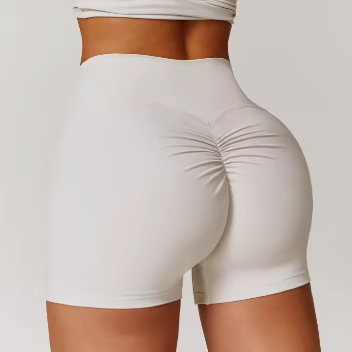 Pantalones cortos de Yoga de cintura alta afilados para mujer, pantalones cortos deportivos ajustados de secado rápido con realce de melocotón para correr y Fitness - 1