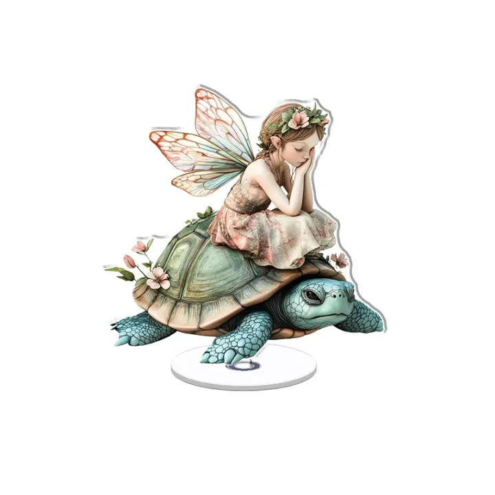 El adorno acrílico giratorio presenta una vibrante hada alada con un vestido sobre una linda tortuga azul, que muestra detalles intrincados sobre un fondo blanco. - 1