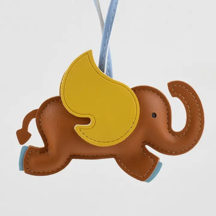 LLavero de elefante con alas voladoras de cuero PU multicolor, llavero de coche, colgador de cuero PU de Animal, colgante de bolsa de dibujos animados en 16 colores para hombres - 1