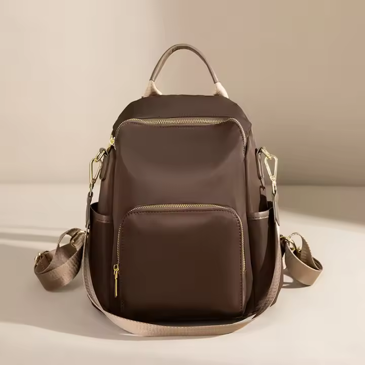 Mochila de moda para mujer, bolsos resistentes a la suciedad, elegantes bolsos traseros de Color café, bolsos de libros informales con estilo para niñas, bolsillos espaciosos antirrobo - 1