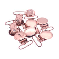 Abrazadera de Chupete Redonda en Oro Rosa para Bebé con Inserto de Plástico para Cinta de 25mm Estilo Sólido Producto Seguro para Niños y Niñas de 4 Meses y Mas - details 0