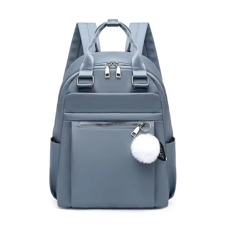 Mochila ligera e impermeable para mujer, bolso de viaje informal, Bola de felpa bonita, color rojo, azul y negro - 1