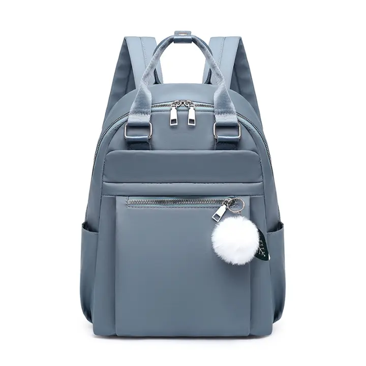 Mochila ligera e impermeable para mujer, bolso de viaje informal, Bola de felpa bonita, color rojo, azul y negro - 1