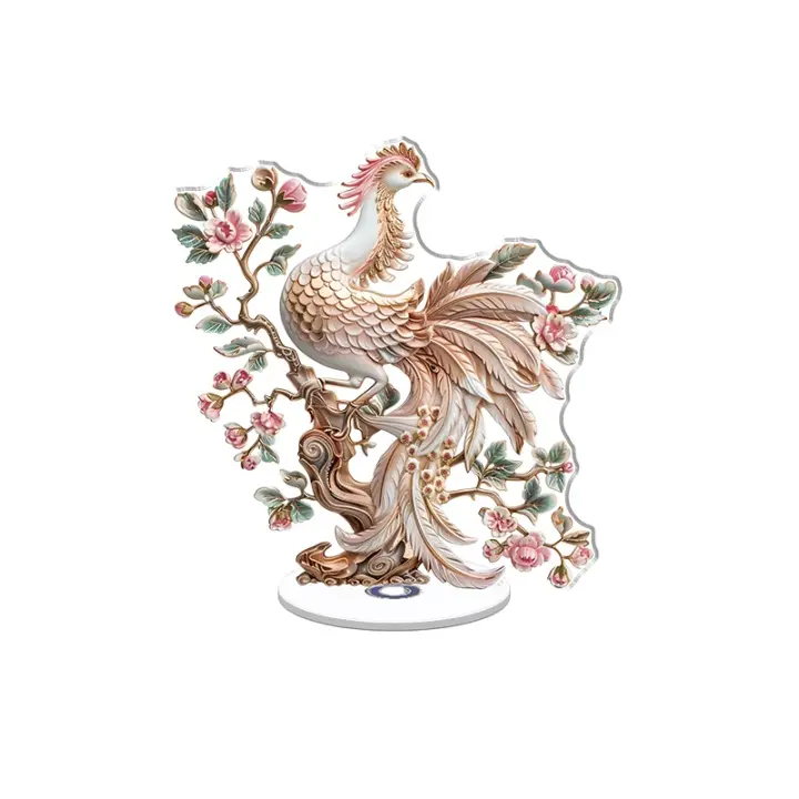 Un adorno acrílico giratorio con un fénix de color suave posado en un antiguo árbol de bronce adornado con delicadas flores rosas y hojas verdes. - 1