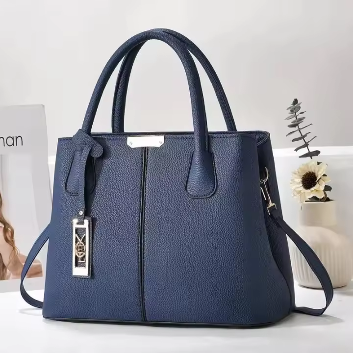 Bolso de mano de Color sólido a la moda para mamá de mediana edad, bolso de hombro sencillo e informal de gran capacidad, mochila de lujo de alta gama - 1