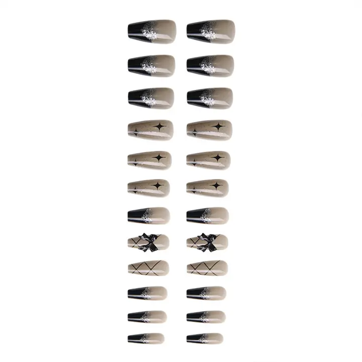 Uñas postizas con patrones negros y estrellas ideales para principiantes en Nail Art - 1