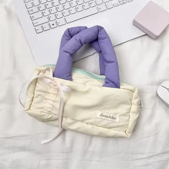 Bolso de mano relleno de algodón de estilo coreano, bolsa de maquillaje con lazo de Color suave y fresco, estuche ligero con cremallera de gran capacidad para niñas - 1