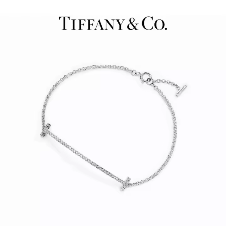 ΤΙΦΑΝΗ ™ Pulsera T, oro amarillo de 18 quilates con diamantes / pulsera de plata brillante y lisa con diseño de sonrisa - 1