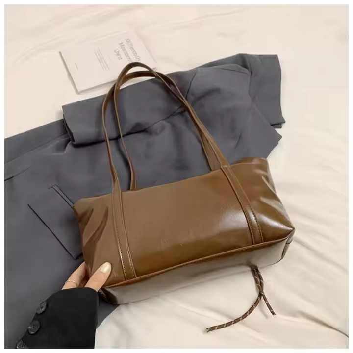 Bolso tipo almohada estilo Boston coreano con colgante, bolso tipo dumpling de PU de color sólido, diseño minoritario vintage para mujer, bolso de hombro para ir al trabajo. - 1