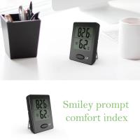 Termómetro de ambiente, mini medidor de humedad, termómetro higrómetro negro, blanco y naranja con pantalla LCD transparente e íconos de cara - details 3