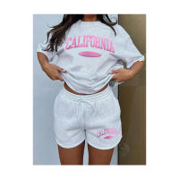 Conjunto de dos piezas de camiseta de manga corta y pantalones cortos de color gris claro para verano, unisex, informal y deportivo. - details 0