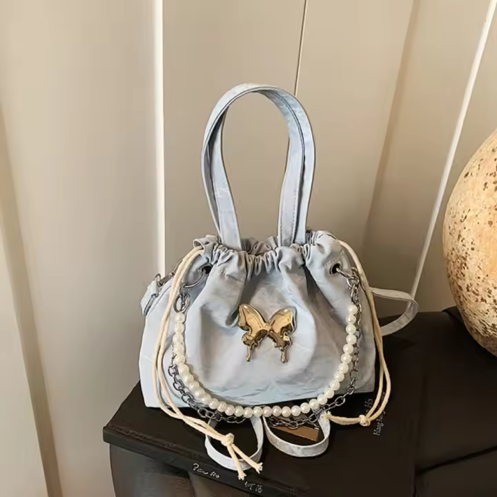 Mochila de mariposa plateada con hebilla magnética, decoración de mariposa, cadena de Metal, bolso de hombro con cordón, gran capacidad, Color sólido - 1