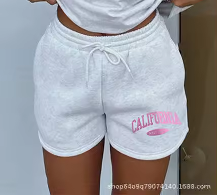 Conjunto de dos piezas de camiseta de manga corta y pantalones cortos de color gris claro para verano, unisex, informal y deportivo. - 1