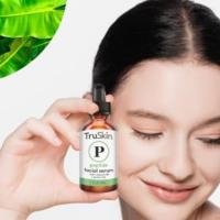 Image of woman applying serum