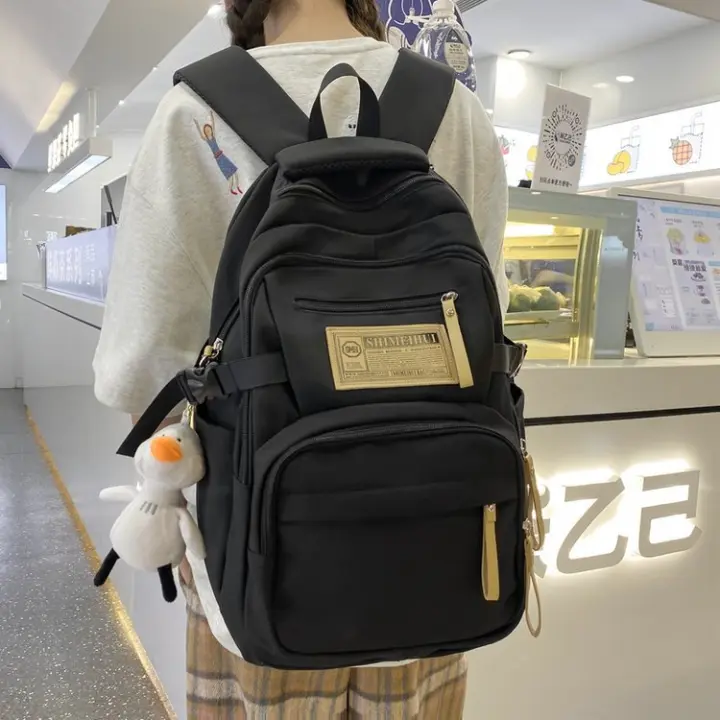 Mochila de Nylon de Gran Capacidad Ideal para Estudiantes Universitarios, de Secundaria, de Preparatoria Moda Callejera - 1