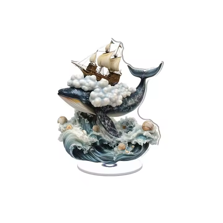 Una escultura acrílica giratoria de una ballena saltando del mar con nubes y un barco rodeado de olas y conchas de resina. - 1