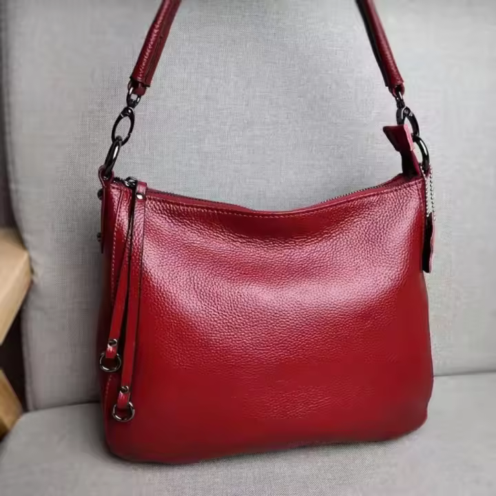 Bolso de cuero genuino popular, nuevo bolso de mujer de cuero versátil y a la moda, bandolera de un solo hombro, bolso bandolera portátil. - 1