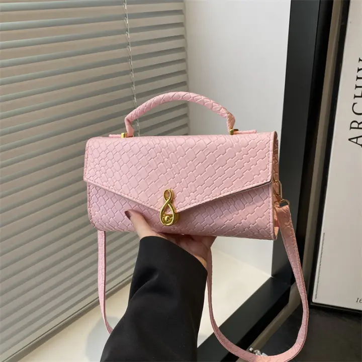 2025 Primavera y verano color sólido nuevo tejido superficie suave elegante textura de gran capacidad bolso de mano horizontal para las axilas para mujeres - 1