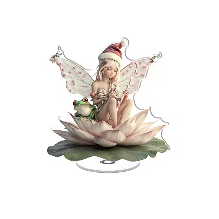 Expositor acrílico giratorio con una hada en una flor de loto con un bastón de caramelo y una linda rana con un sombrero navideño sobre un fondo blanco - 1