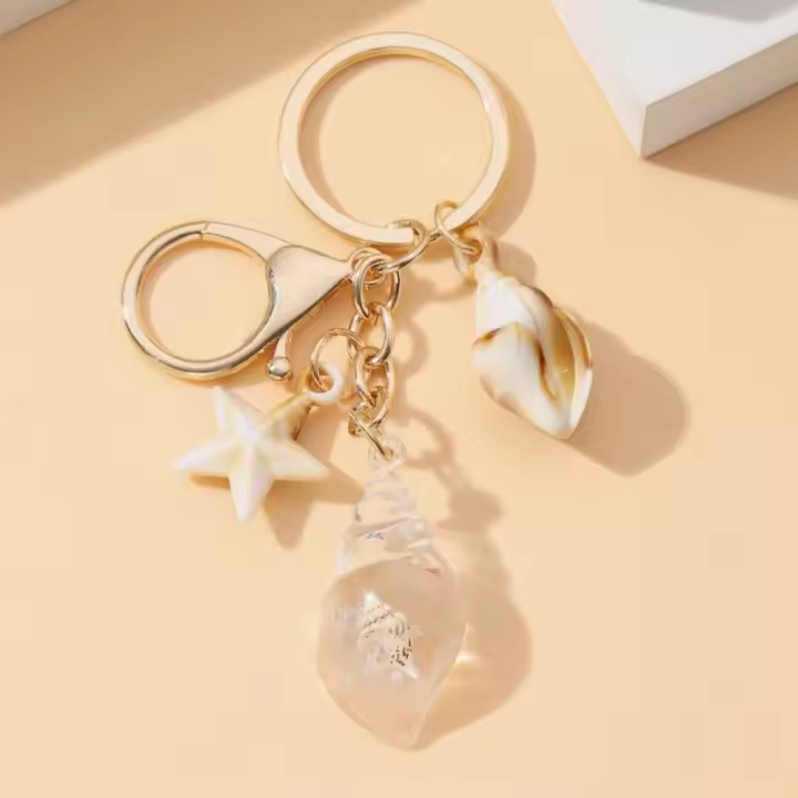 Llavero de concha luminosa, estilo bohemio, colgantes de playa de mar que brillan en la oscuridad, dijes creativos, llavero de concha de estrella de mar para verano - 1